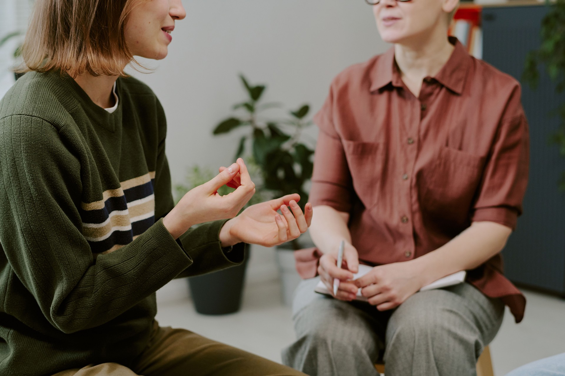 Engaging in Counseling Session Indoors with Therapist